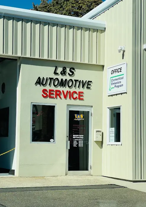 L & S Automotive happy customer standing in front of our dealership picture